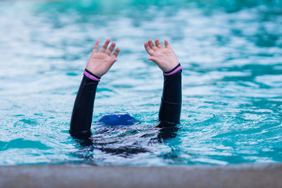 Low section of woman in swimming pool