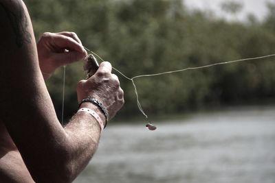 Close-up of hands holding fish