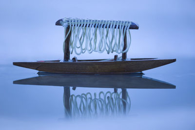 Close-up of table against blue background