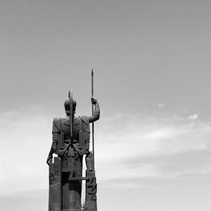 Low angle view of statue against sky