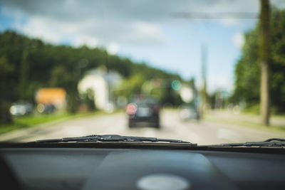 Road seen through car windshield