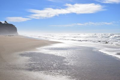 Scenic view of beach against sky