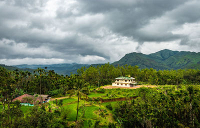 House at remote village isolated with mountain coverd clouds and green forests