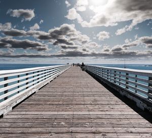 Pier over sea against sky