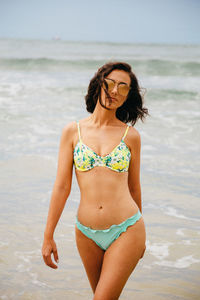 Beautiful young woman on beach