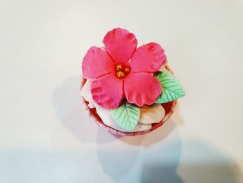 Directly above shot of pink cake on white table