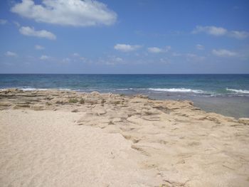 Scenic view of beach against sky