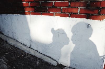 Shadow of people on wall