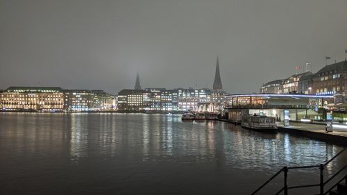 Illuminated city at waterfront