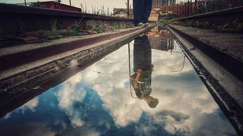 View of bridge against cloudy sky