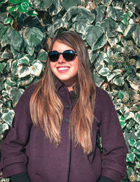 Portrait of a smiling young woman outdoors