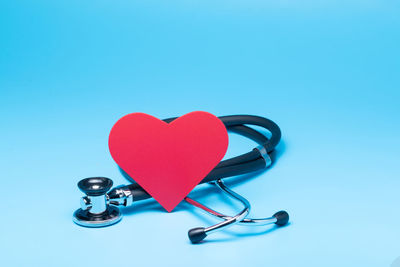 Close-up of heart shape against blue background