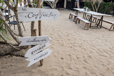 Information sign on table at beach