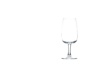 Close-up of wineglass against white background