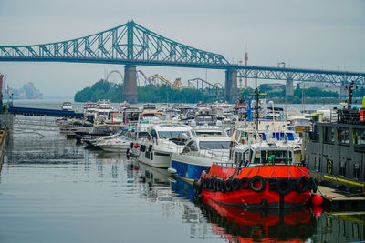 Boats moored at harbor