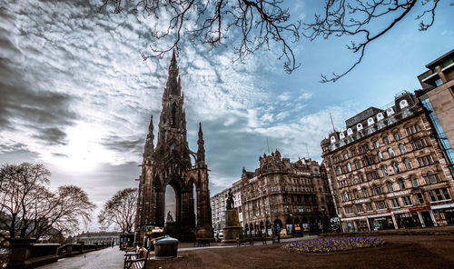 View of old buildings against sky in city