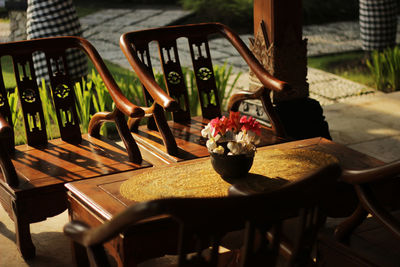 Wooden chairs and tables exposed to the afternoon sun