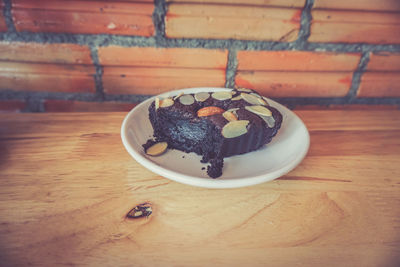 Chocolate cake in bowl on table