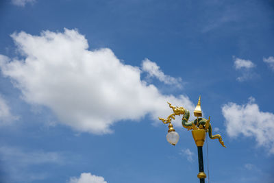 Low angle view of street light against sky