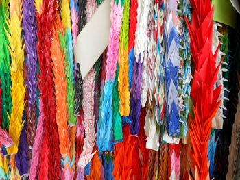 Close-up of multi colored umbrellas hanging at store