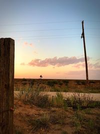 Scenic view of field against sky during sunset