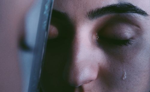 Close-up of young woman crying