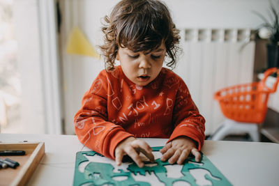 Boy looking at camera at home