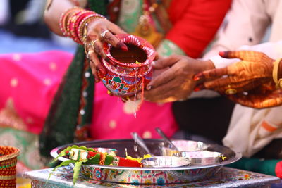 Midsection of people having food