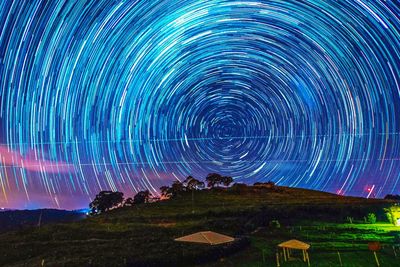 Scenic view of illuminated mountain against sky at night