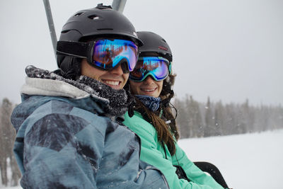 Portrait of man and woman on snowy mountain