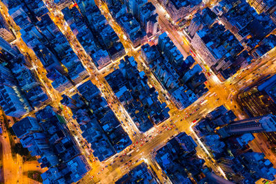 Aerial view of modern buildings in city at dusk