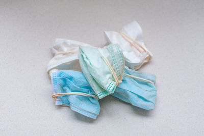 High angle view of blue paper on white table