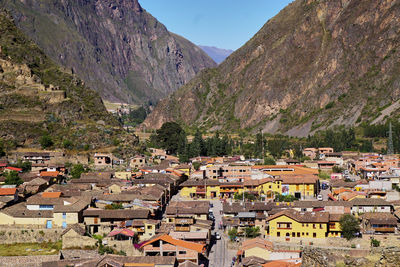 High angle view of townscape and mountains