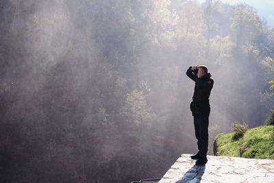 Man photographing at camera