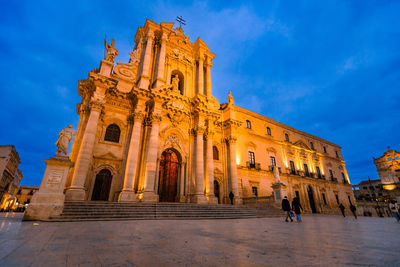 Cathedral of syracuse in ortigia at sunset with people