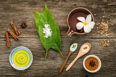 High angle view of spices in bowl on wooden table