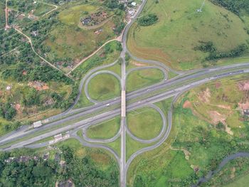 High angle view of highway amidst trees in city