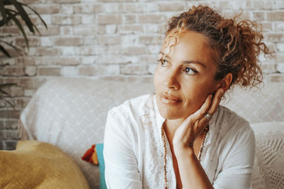 Mature woman sitting at home