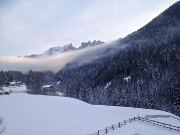 Scenic view of snow mountains against sky