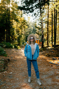 Portrait of man standing in forest