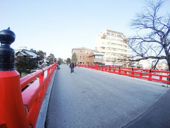 Road in city against clear sky