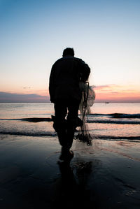 Scenic view of sea at sunset