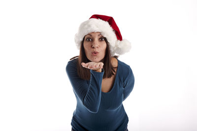 Portrait of a serious young woman against white background
