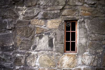 Old stone wall with window. church 
