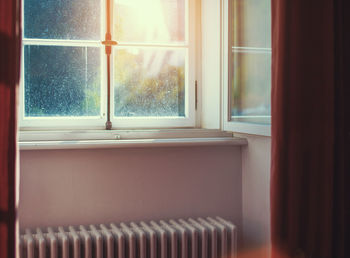 Radiator by closed window at home