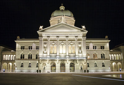 Facade of historic building at night