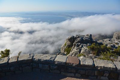 Scenic view of mountains against cloudy sky