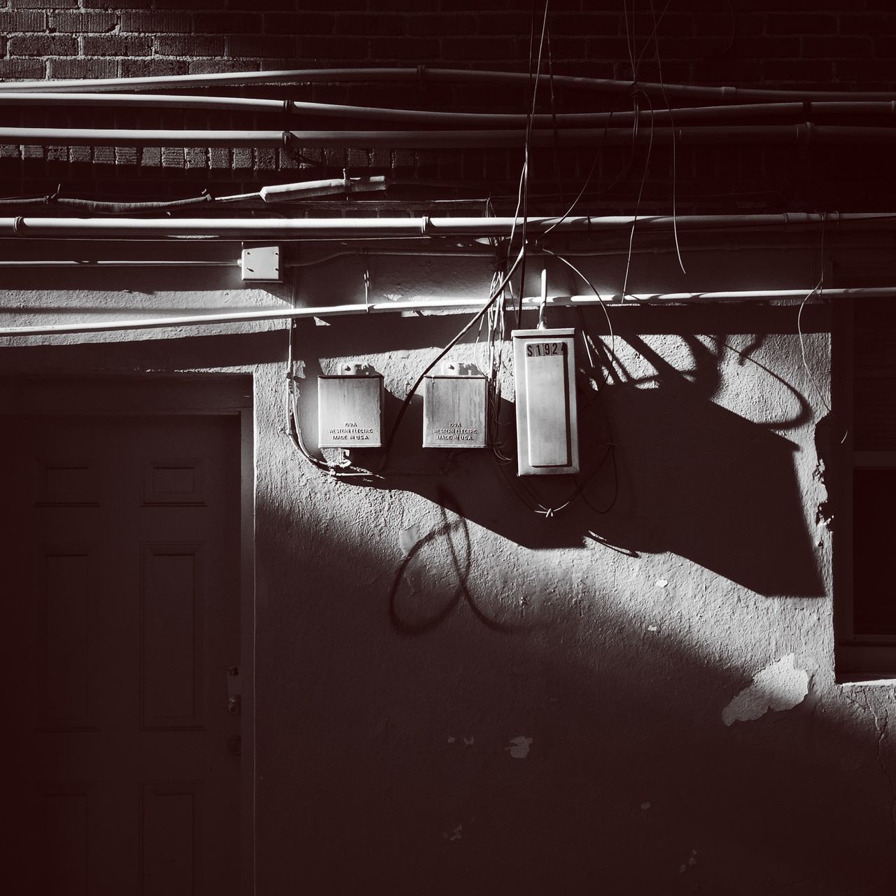 architecture, built structure, building exterior, window, house, old, indoors, abandoned, absence, no people, door, sunlight, closed, wall - building feature, obsolete, day, brick wall, residential structure, wall, building