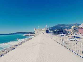 View of beach against blue sky