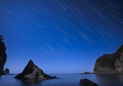 Star trails over the sea at futou coast in izu peninsula, shizuoka prefecture, japan